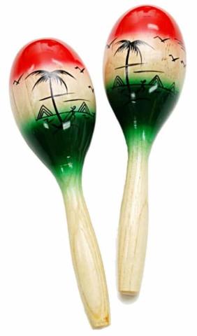 A pair of red, tan, and green maracas with mountains, palm trees, and flying birds silhouettes