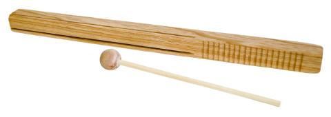 A wooden stick with ridges carved in one end with a mallet next to it